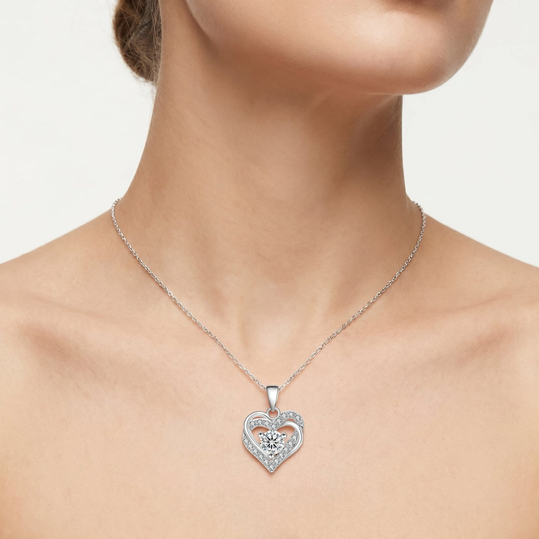 Stockholm Moissanite Intertwined Heart Necklace worn on neckline